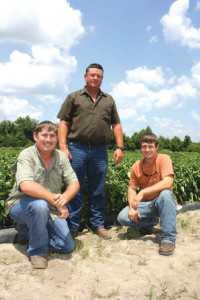 Justin, Ken, and Jared Corbett (L-R) have implemented the latest technology in the field and the packing house to produce high-quality vegetables in the safest environment possible. Photo credit: Rosemary Gordon