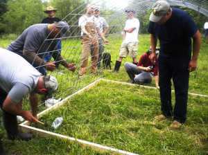 Military veterans-turned-beginning-farmers learn how to build mobile hoop houses at an Armed to Farm workshop at the University of Arkansas in Fayetteville, AR. (USDA photo)