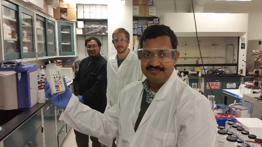 Associate professor Dr. Swadeshmukul Santra holds a sample of Zinkicide in his UCF nanotechnology lab. Photo courtesy of UCF
