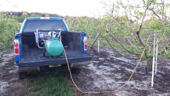 Water pump collecting leachate in Florida peach orchard