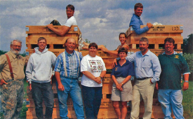 It’s all in the name of family cooperation at Hollabaugh Bros. In the bins, left to right: James Hollabaugh (Harold’s son), Ellie Hollabaugh (Brad’s daughter), and Bruce Hollabaugh (Brad’s son). In front of the bins, left to right: Donald, David Hollabaugh (Harold’s son), Steve, Vicky Hollabaugh (Steve’s wife), Kay (Brad’s wife), Brad, and Neil. (Photo credit: Steve Hollabaugh)