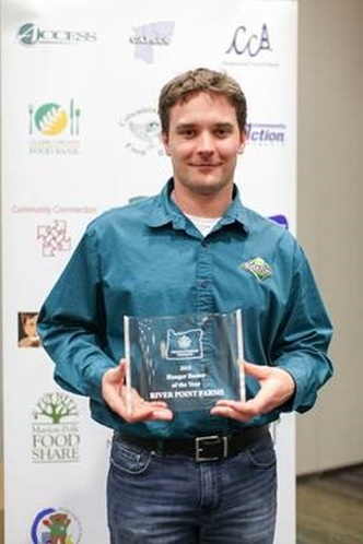 Jonathan Miller, production manager, River Point Farms Fresh Pack Facility, accepts Oregon Food Bank's Hunger Buster award on behalf of River Point Farms. Photo credit: River Point Farms