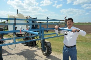 Dr. Juan Enciso, a Texas A&M AgriLife Research irrigation engineer in Weslaco, examines sensors that will one day be mounted on drones to evaluate crops. Photo by Rod Santa Ana, Texas AgriLife Communications   