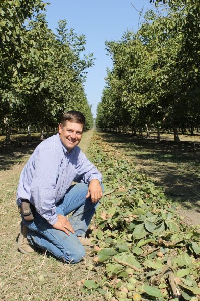 John Amarel, of Reason Farms in Yuba City, CA, during walnut harvest. (Photo Credit: David Eddy)