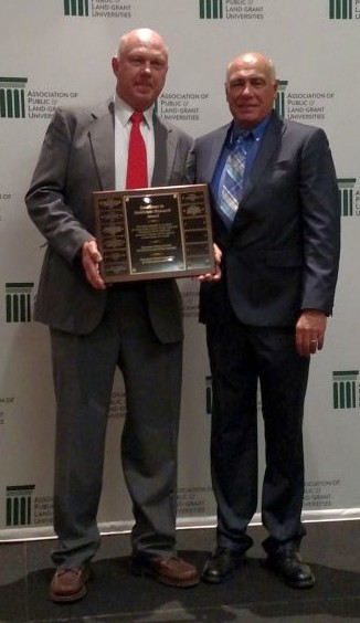 Win Cowgill of Rutgers University and Ron Perry of Michigan State University accept the award on behalf of NC-140. (Photo courtesy of Win Cowgill)