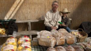 An apple vendor at Four Seasons Winter Farmers Market FEATURE