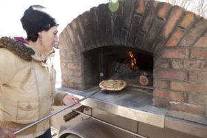 Brick oven pizza at Four Seasons Winter Farmers Market