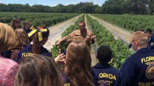 Gary Reeder of West Coast Tomato/McClure Family Farms in Florida takes learning full circle as he speaks to a young FFA audience on an ag tour. Photo credit: Manatee County Farm Bureau , Dan Wes