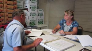 James Weaver of Meadow View Farm goes over his food safety records with a Pennsylvania Department Of Agriculture’s food safety inspector. Photo credit: Peggy Fogart