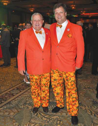 Marty McKenna and Mark Wheeler show off thier orange suits at the Florida Citrus Industry Annual Conference