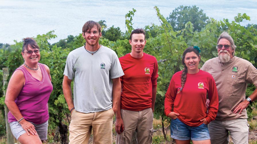 The team at Sawmill Creek Vineyards which includes Tina Hazlitt, Jason Hazlitt, Ryan Yaskulski, Courtney Griffin, and Eric Hazlitt take great pride in their vineyard, knowing their customers have come to depend the vineyard’s attention to detail. (Photo credit: Christina Herrick)