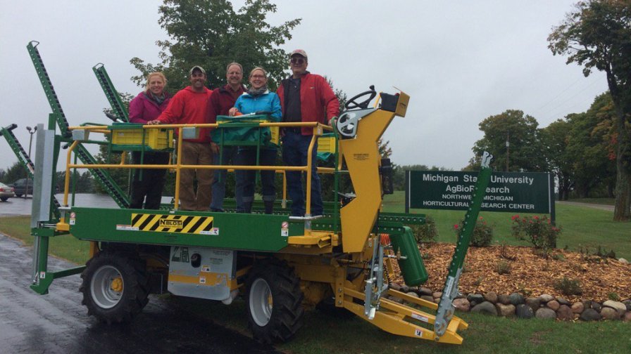 The Northwest Michigan Horticulture Research Center staff and Mark Miezio, a Michigan Tree Fruit Commission board member are pictured with the station's new Blosi platform, purchased with funding from the Michigan Tree Fruit Commission. (Photo credit: Northwest Michigan Horticulture Research Center)
