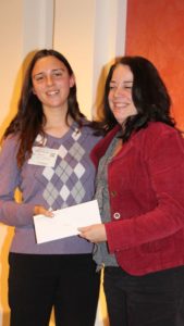 Stephanie Makela of Michigan State University, left, receives a scholarship from Carol Miller, Editor of American Vegetable Grower magazine. (Photo credit: David Eddy)