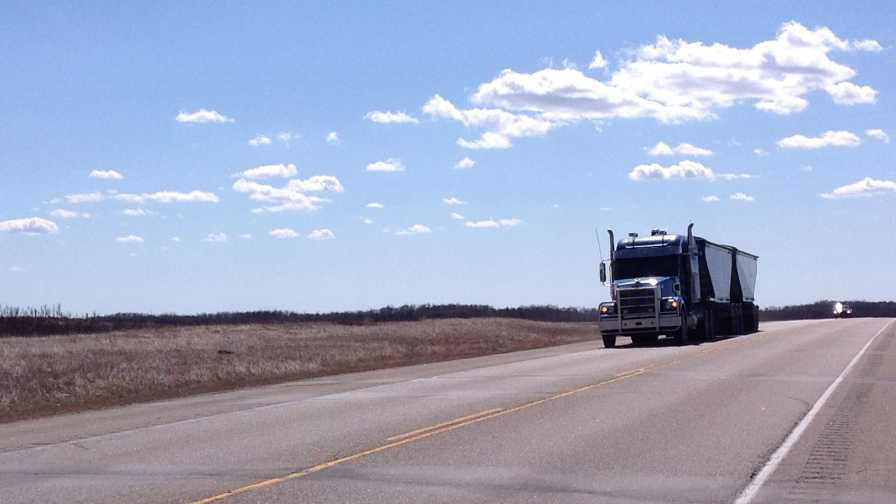 Semi truck barreling down the highway