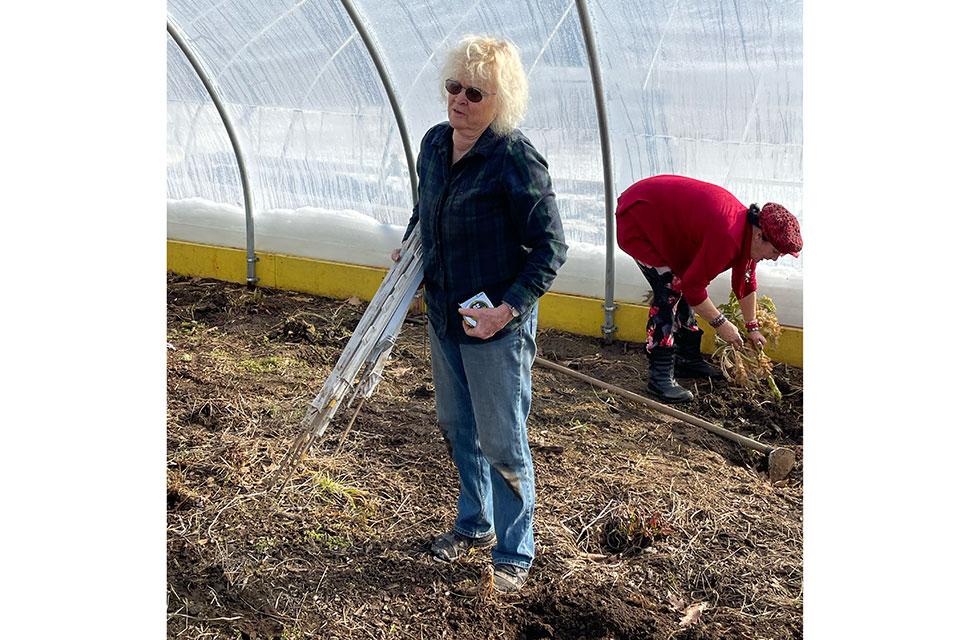 Jule Rawson in hoop house at Many Hands Organic Farm