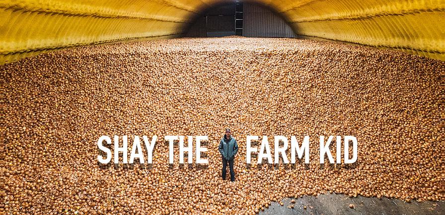 Shay Myers, aka, Shay the Farm Kid in a warehouse full of onions